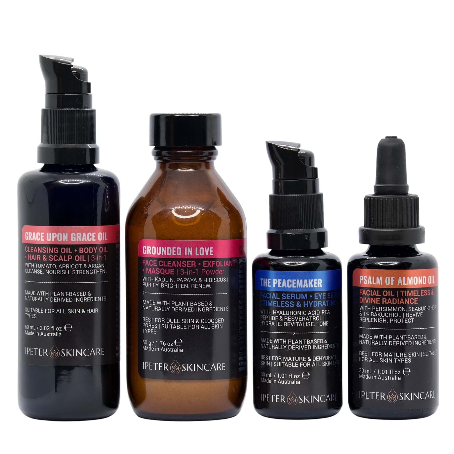 four black and amber skincare bottles of ipeter
